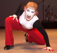 Deena performs a narrated mime in three roles, as a satanic accuser . . .